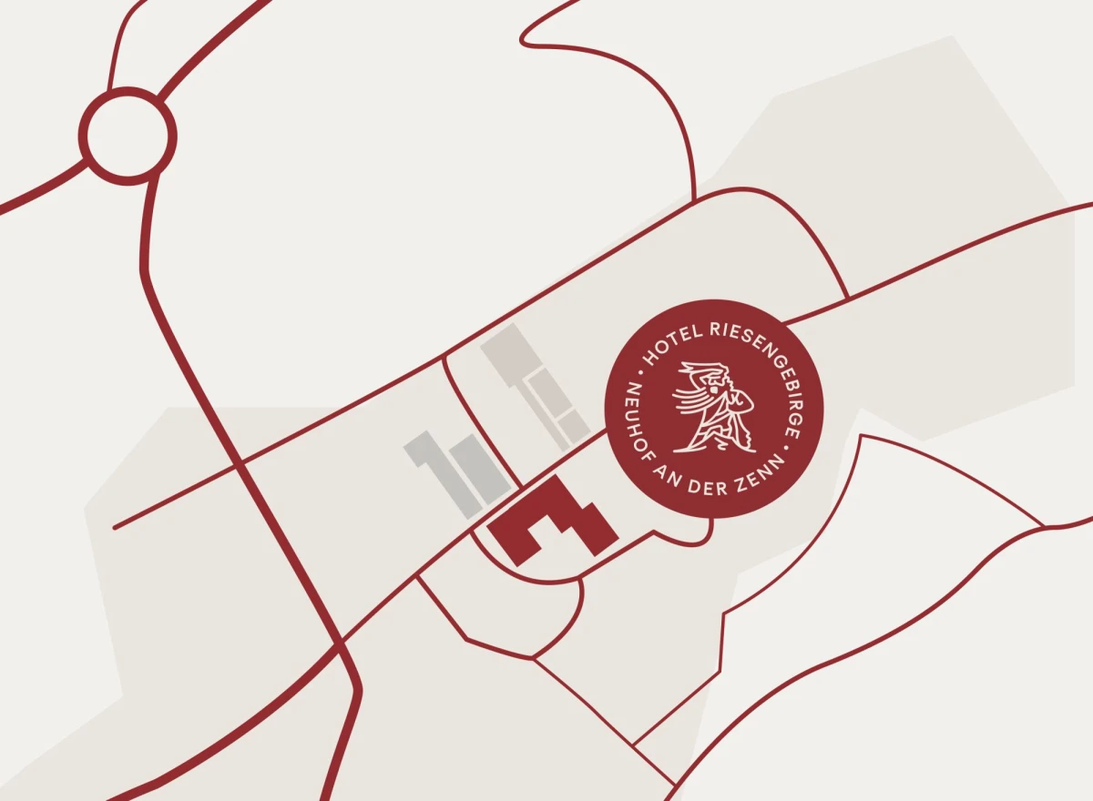 Schematische Karte mit Standortmarkierung f&uuml;r das Hotel Riesengebirge in Neuhof an der Zenn. Rote Linien zeigen Stra&szlig;en und Wege, mit einem roten Siegellogo des Hotels an einer Schl&uuml;sselstelle der Karte.